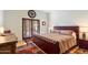 Bedroom with leather bed, wood floors, and access to patio at 24218 N 85Th St, Scottsdale, AZ 85255