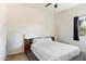 Bright bedroom with a queen-size bed and a floating shelf at 24218 N 85Th St, Scottsdale, AZ 85255
