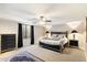 Relaxing bedroom with a queen bed and ceiling fan at 24218 N 85Th St, Scottsdale, AZ 85255