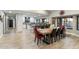 Modern dining room with large table and kitchen view at 24218 N 85Th St, Scottsdale, AZ 85255