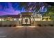 Ornate iron gate opens to a beautiful desert home at 24218 N 85Th St, Scottsdale, AZ 85255