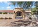 Elegant arched entry gate to a private estate at 24218 N 85Th St, Scottsdale, AZ 85255