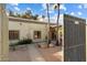 Front courtyard with gated entry and stone pathway at 24218 N 85Th St, Scottsdale, AZ 85255