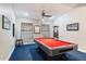Game room with pool table and blue carpet at 24218 N 85Th St, Scottsdale, AZ 85255