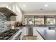 Modern kitchen features stainless steel appliances and backsplash at 24218 N 85Th St, Scottsdale, AZ 85255