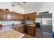 Galley kitchen with granite countertops and stainless steel appliances at 24218 N 85Th St, Scottsdale, AZ 85255