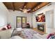 Inviting living room with fireplace, wood ceiling, and French doors at 24218 N 85Th St, Scottsdale, AZ 85255