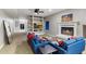 Living room features a fireplace, built-in shelving, and comfortable seating at 24218 N 85Th St, Scottsdale, AZ 85255