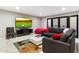 Comfortable living room with gray sectional sofa and large TV at 24218 N 85Th St, Scottsdale, AZ 85255