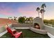 Cozy rooftop patio with a fireplace, perfect for relaxing at 24218 N 85Th St, Scottsdale, AZ 85255