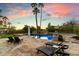 Scenic pool area at sunset with lounge chairs at 24218 N 85Th St, Scottsdale, AZ 85255