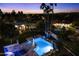 Nighttime view of a resort style pool and spa at 24218 N 85Th St, Scottsdale, AZ 85255
