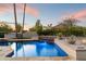 Stunning pool with a water feature and stone patio at 24218 N 85Th St, Scottsdale, AZ 85255