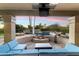Evening view of a relaxing poolside patio with fire pit at 24218 N 85Th St, Scottsdale, AZ 85255