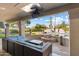 Relaxing poolside patio with fire pit and comfortable seating at 24218 N 85Th St, Scottsdale, AZ 85255