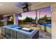 Sunset view of a relaxing poolside patio with fire pit at 24218 N 85Th St, Scottsdale, AZ 85255