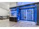 Glass-enclosed wine cellar; ample storage and blue lighting at 24218 N 85Th St, Scottsdale, AZ 85255