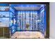 Modern glass-enclosed wine cellar with extensive storage at 24218 N 85Th St, Scottsdale, AZ 85255