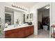 Bathroom with double sink vanity, shower, and walk-in closet at 2507 W Maldonado Rd, Phoenix, AZ 85041