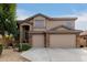 Two-story house with three-car garage and landscaped front yard at 2507 W Maldonado Rd, Phoenix, AZ 85041