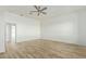 Spacious bedroom with wood-look floors and ensuite bath at 30502 N 235Th Ln, Wittmann, AZ 85361