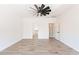 Bright bedroom with wood-look tile flooring and ceiling fan at 3059 E Hazeltine Way, Chandler, AZ 85249