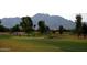 Golf course with mountain views and players visible at 3059 E Hazeltine Way, Chandler, AZ 85249