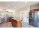 Kitchen with island, stainless steel appliances, and wood cabinets at 3059 E Hazeltine Way, Chandler, AZ 85249