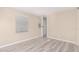 Cozy bedroom with wood-look flooring and neutral walls at 322 N 89Th St, Mesa, AZ 85207