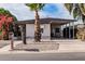 Charming single-story home with carport, desert landscaping, and palm trees at 322 N 89Th St, Mesa, AZ 85207