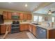 Modern kitchen featuring dark wood cabinets and new appliances at 40160 W Mary Lou Dr, Maricopa, AZ 85138