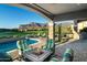 Relaxing patio with fire pit, pool, mountain views, and comfortable seating at 4060 S Camino De Vida --, Gold Canyon, AZ 85118