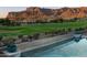 Relaxing pool area overlooking a golf course and mountains at 4060 S Camino De Vida --, Gold Canyon, AZ 85118