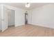 Bright bedroom with light hardwood floors and ample closet space at 4620 E Montecito Ave, Phoenix, AZ 85018