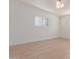 Light and airy bedroom with hardwood floors and plantation shutters at 4620 E Montecito Ave, Phoenix, AZ 85018