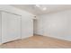 Spacious bedroom with double door closet and light hardwood floors at 4620 E Montecito Ave, Phoenix, AZ 85018
