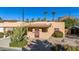 Charming stucco home with a red tile roof, landscaped yard, and a wooden door at 4620 E Montecito Ave, Phoenix, AZ 85018