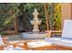 Ornate tiered fountain in a tranquil garden setting at 4620 E Montecito Ave, Phoenix, AZ 85018