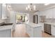 Modern kitchen featuring white cabinets, quartz countertops, and stainless steel appliances at 4620 E Montecito Ave, Phoenix, AZ 85018