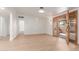 Spacious living area with light wood flooring and access to the front patio at 4620 E Montecito Ave, Phoenix, AZ 85018