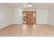 Bright living room with light wood flooring and a view of the front door at 4620 E Montecito Ave, Phoenix, AZ 85018