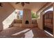 Covered patio featuring a fireplace and built-in bench, perfect for relaxing at 4620 E Montecito Ave, Phoenix, AZ 85018
