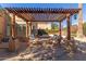 Relaxing patio seating under a wooden pergola at 4620 E Montecito Ave, Phoenix, AZ 85018
