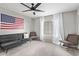 Bedroom with American flag, sofa and two chairs at 540 N May St # 1102, Mesa, AZ 85201