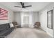 Bedroom with American flag, sofa and two chairs at 540 N May St # 1102, Mesa, AZ 85201