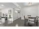 Small dining area with dark gray table and four chairs at 540 N May St # 1102, Mesa, AZ 85201