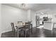 Dining area with four chairs and kitchen views at 540 N May St # 1102, Mesa, AZ 85201