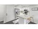 Modern kitchen with stainless steel appliances and breakfast bar at 540 N May St # 1102, Mesa, AZ 85201