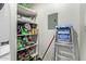 Small laundry room with shelving and supplies at 540 N May St # 1102, Mesa, AZ 85201
