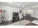 Living room with TV, dining area view, and dark flooring at 540 N May St # 1102, Mesa, AZ 85201